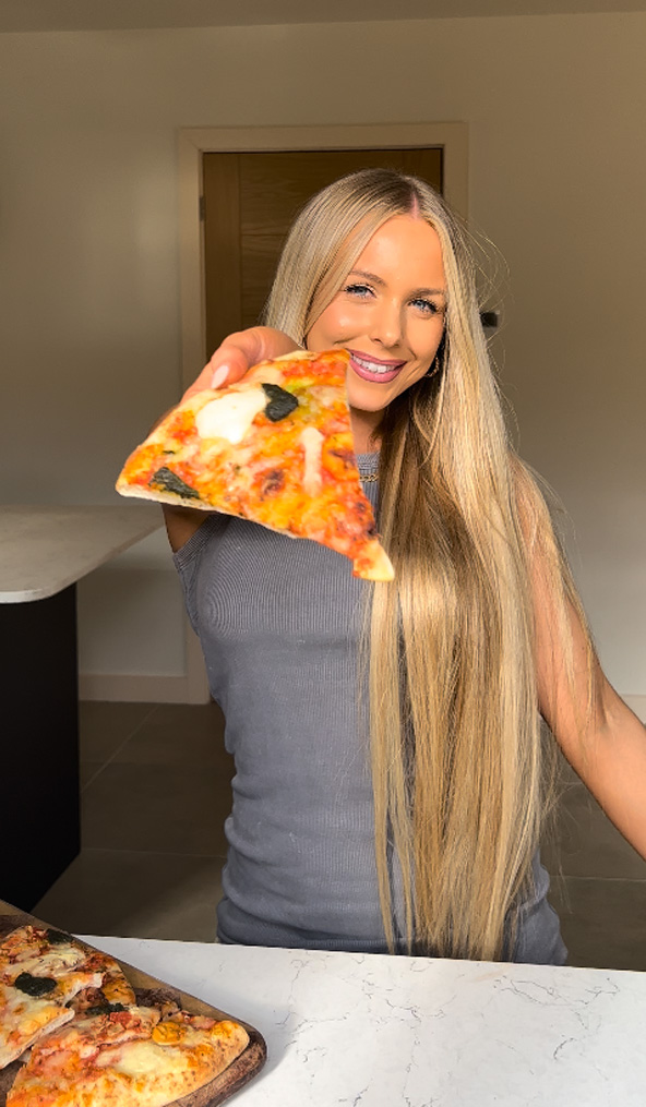 Emma enjoying her homemade pizza
